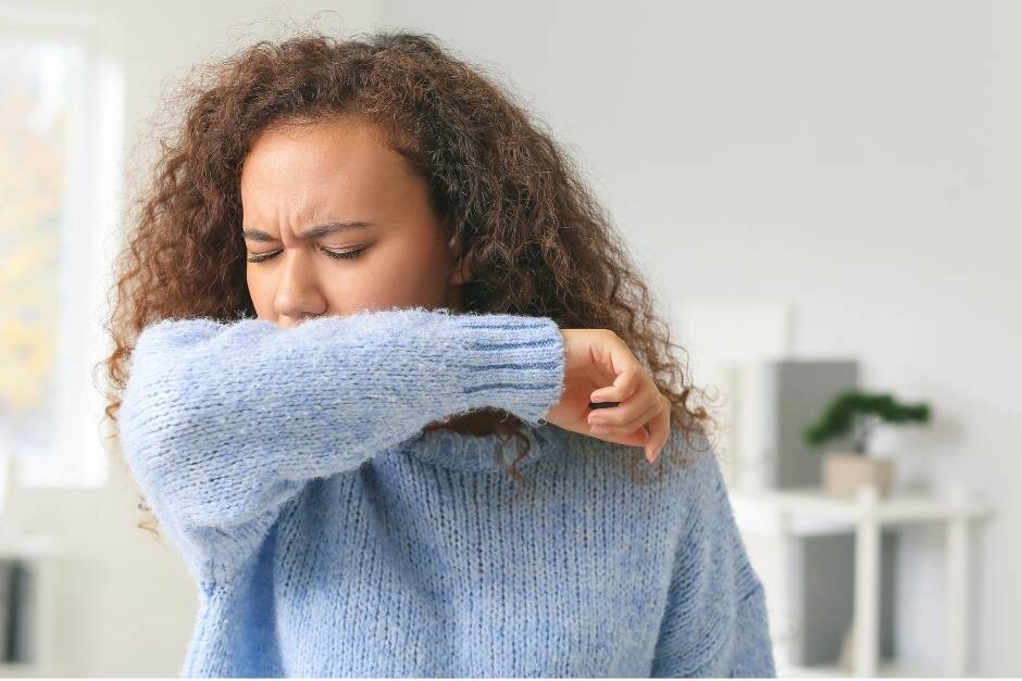 Are bernedoodles hypoallergenic? Picture of woman sneezing